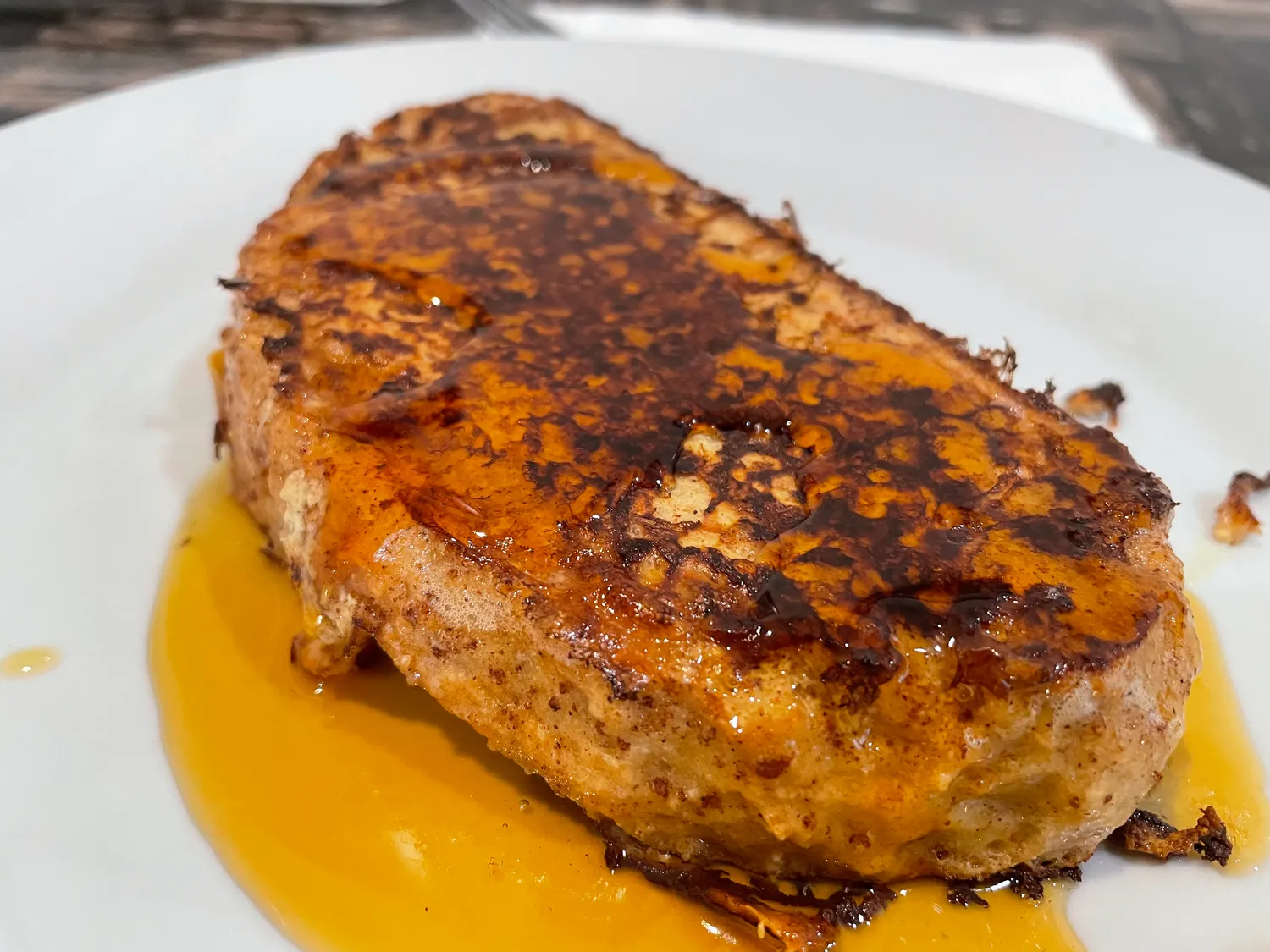 French toast in syrup on a plate