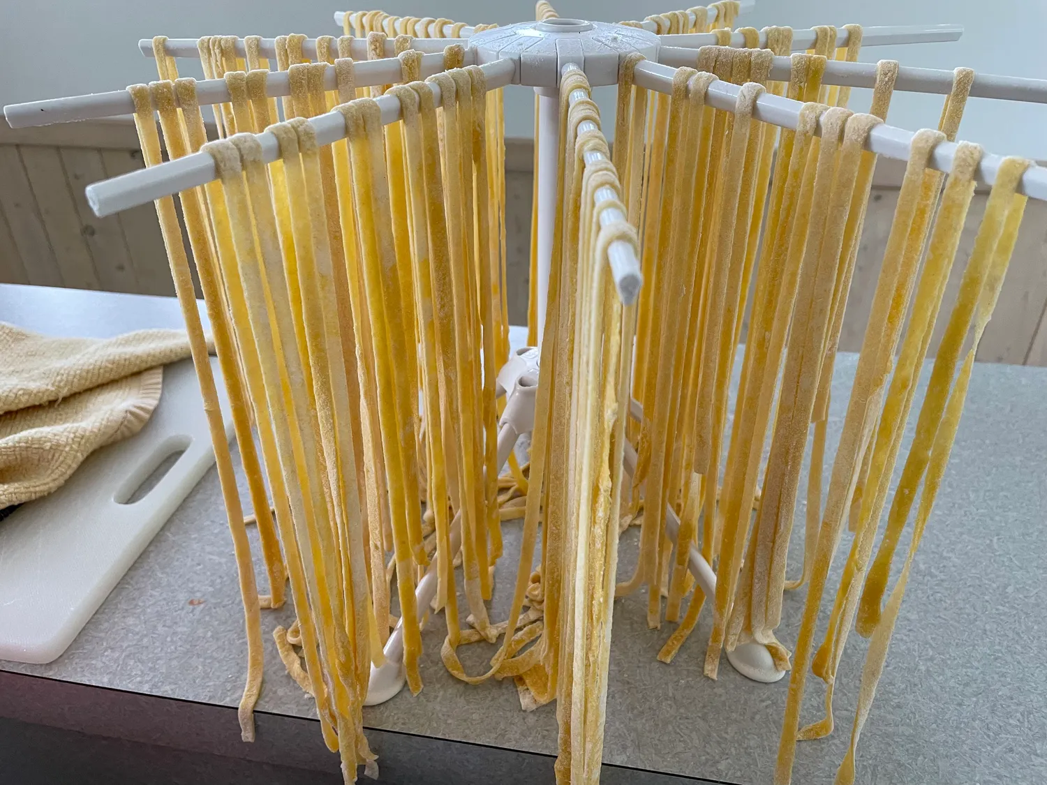 Pasta hanging on a drying rack